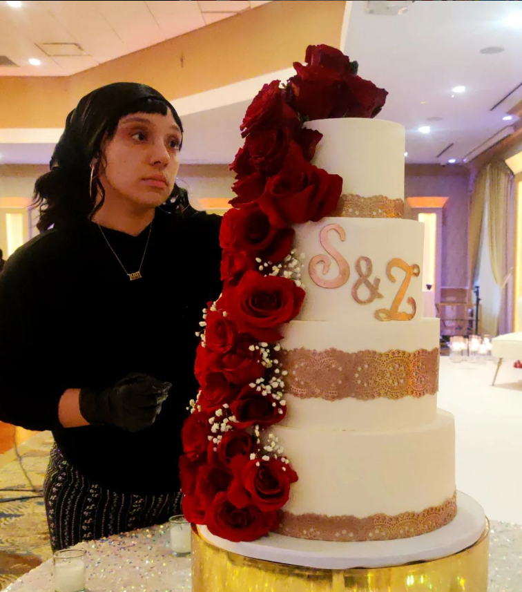 Aly working on a tiered wedding cake